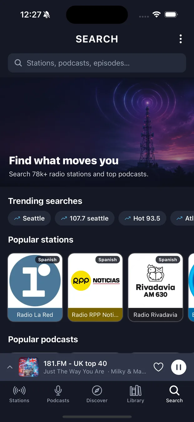 The Search tab with trending searches and popular stations.